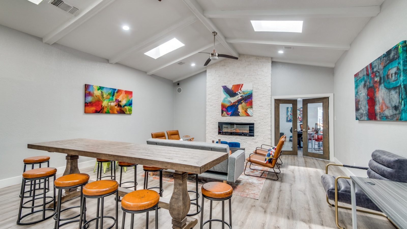 a living room with a pool table and bar stools at The  Booker